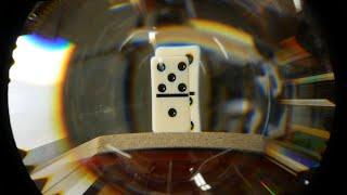 Hypercentric optics: A camera lens that can see behind objects