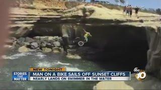 Man on bike jumps off Sunset Cliffs, nearly hits swimmer