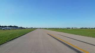 In the back of a VW, ride along the vintage flight lines at Oshkosh