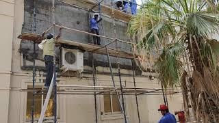 Plaster on wall by machine