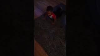 Baby trying to show daddy how to do push ups