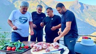 Cooking a national Dagestan dish in a cauldron over a fire