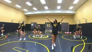 Local high school cheerleading squad tackles COVID-19 virus