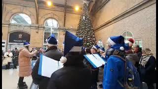 choir singing at York Station, Christmas 2022