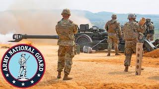 US Army National Guard. Powerful M777 howitzers during direct fire.