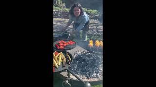 Genevieve Taylor BBQing on a wood fired fire pit, made by FirepitsUK