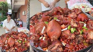 A Chinese Guy Cook Free Huge Pork Street Food for the elders on the Street in a Village