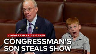 Unsuspecting congressman's speech upstaged by son's hilarious antics