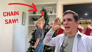 HE took a Chainsaw to our Christmas tree! Our tree is Ruined!