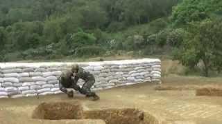 Chinese soldier drops "grenade"