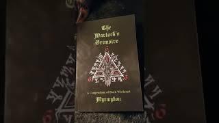 'The Warlock's Grimoire: A Compendium of Black Witchcraft' book overview.