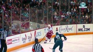 Pavel Datsyuk evades the big hits from Alex Edler and Tuomo Ruutu