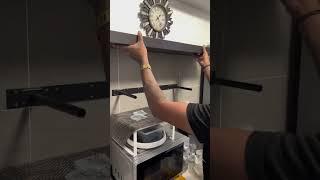 Installation of IKEA floating shelves in the kitchen .
