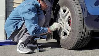 Helping my Neighbor to change his tire. Winter Tire to All Season Tire