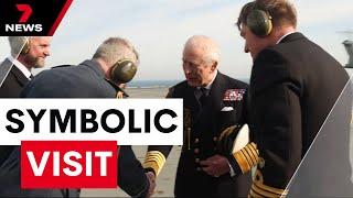 King Charles makes a rare flying visit to troops on an aircraft carrier | 7NEWS