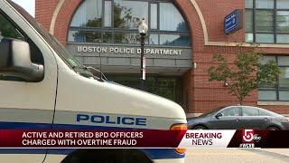 9 Boston police officers charged in overtime fraud scheme