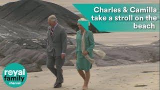Prince Charles and Camilla take a stroll on the beach in Ireland