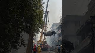 Ahmedabad Plane Crash Recovery: Cranes Lift Wreckage in Narrow Street