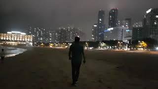 Walking on Haeundae Beach on a summer night