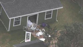 Aerial video after SUV crashes through Spring-area house