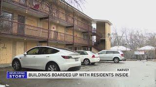 Buildings boarded up with residents inside