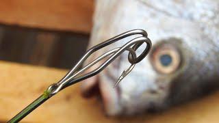 See what ingenious tool the fisherman makes to remove the hooks from the fish