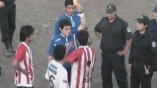 Footballer sent off for throwing dog against a fence in Argentina