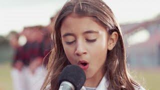 Watch: Reina Ozby Sings The Star-Spangled Banner