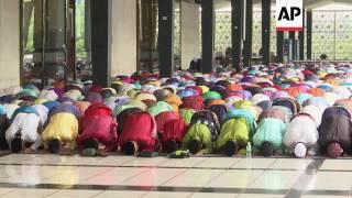 Muslims in Malaysia mark Eid with prayers