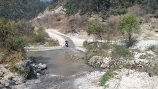Water crossing in Guatemala on Motorcycle