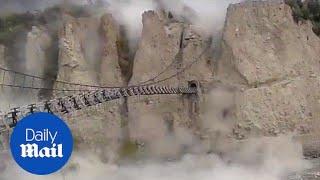 Suspension bridge swings violently during Pakistan earthquake - Daily Mail