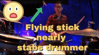 Flying stick nearly stabs drummer!