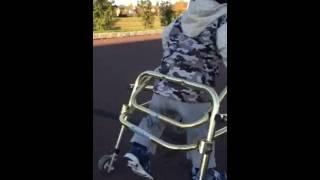 Ethan McIntosh - learning to walk in his rolling walker