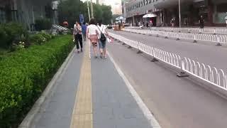 Asian Amputee Girl-Asian OOE Amputee Walking In The Street With One Crutch-Right Leg & Arm Amputated