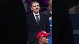 Barron Trump reacts to the crowd after dad acknowledges him at inauguration