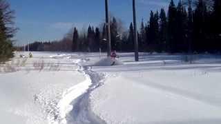 Yamaha phazer in really deep snow carving in hydro lines