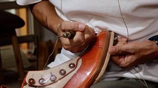 Crafting a Classic: Handmade Button Boots in White and Red Leather