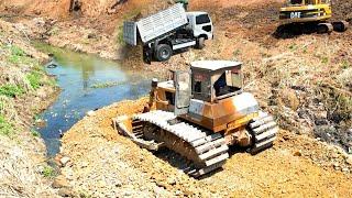 Wonderful Heavy Old Bulldozer SHANTUI Working push stone and Dump truck 5T unloading stone filling.