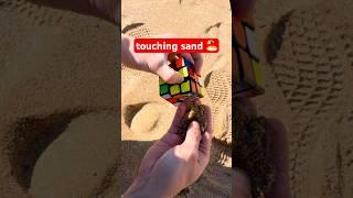 Rubik's Cube touches sand for the first time