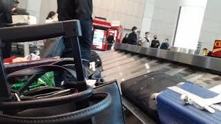 AT THE TORONTO AIRPORT , CHECK OUT LUGGAGE WITH THE HELP OF THE PORTER