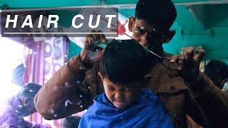 Haircut in local barber shop.