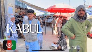 AFGHANISTAN - Walk through an open air bazar in central Kabul 2022; open carry, street food, shops