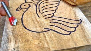 Beautiful wood carving bird with router machine bits.