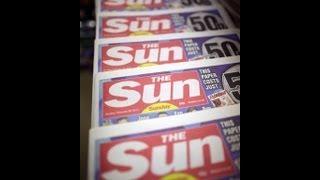 Headline: Reporters of Britain's Sun, Daily Mirror charged with bribery