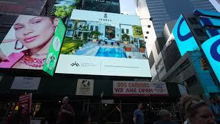 Alexander Gurman filming Times Square Billboards, square billboard on Broadway and 47th street