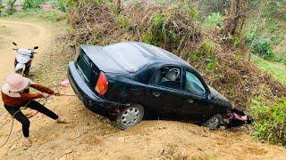 How will the girl save it? when a car meets with an accident and almost falls off the cliff?