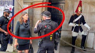 Armed Officers Confronts a Lady for Wandering into King's Guards Restricted Area