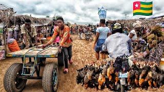 Rural village market day in Assahoun Togo west Africa .  Cost of living in an African village.