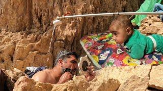 The life of a nomadic father and his baby: The hair cut of a nomadic father in the mountains