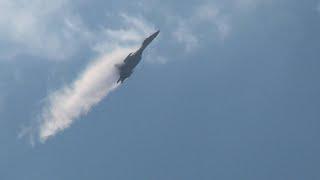 Su-35, Su-34 and Su-57 fly in clouds with vortices.